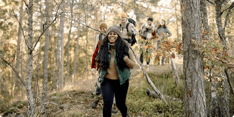 friends hiking through a forest